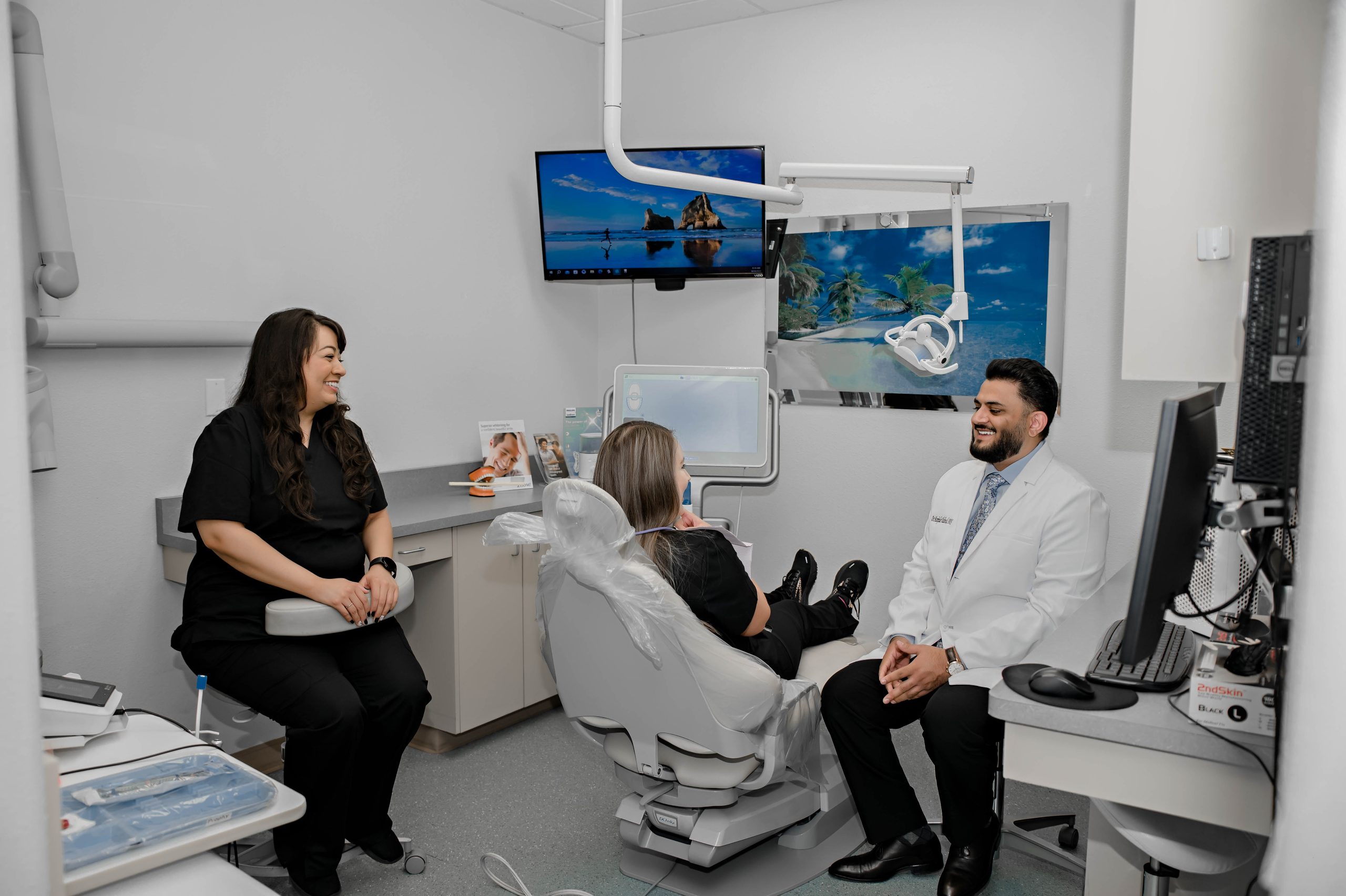 Dentist consulting with an emergency dental patient at Smile Bright Family Dentistry in Newman, CA